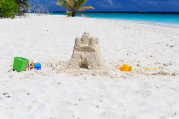 Sand castle on tropical beach