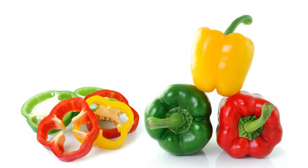 green yellow red pepper on white background