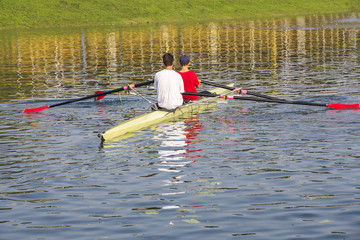 Two rowers in a boat © smuki