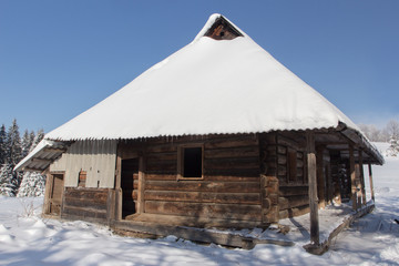 Small house in the snowy mountains