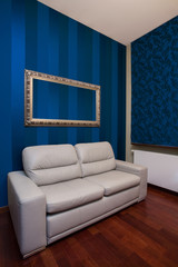 Sofa in room with blue walls