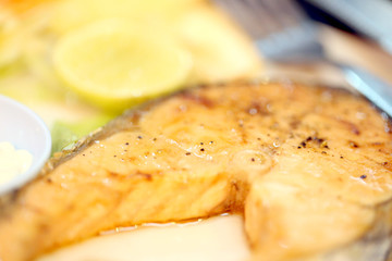 Salmon steaks on the dish.