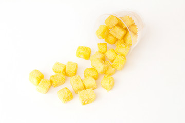 baking biscuit covered by sugar and cheese in plastic cup