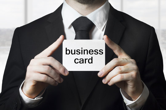 businessman holding sign business card