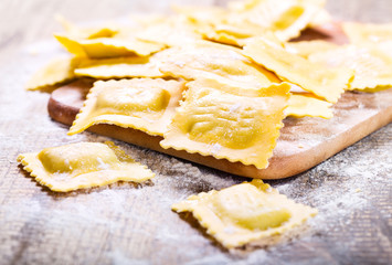 Raw ravioli with flour