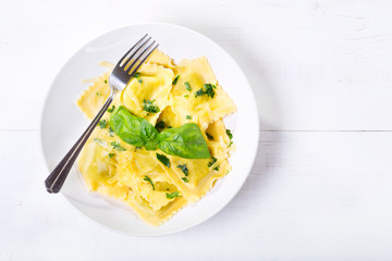 plate of ravioli with basil