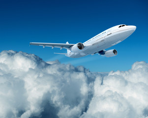 Naklejka na ściany i meble Airplane and clouds