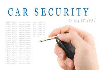 Hand holding car keys isolated on white background