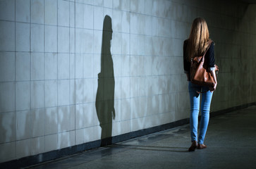 Woman walking alone at night - obrazy, fototapety, plakaty