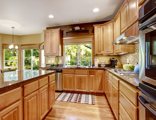 Modern kitchen rooom with island and granite tops