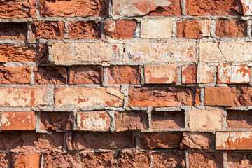 Old weathered grunge red brick wall as background