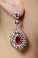 Female ear  in jewelry earrings
