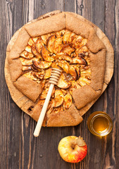 Galette with apples, nuts and honey. Apple pie.