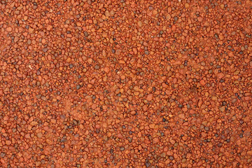 red laterite gravel for background.