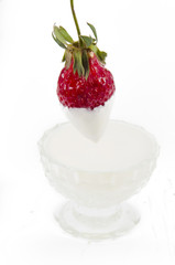 ripe strawberry in ice-cream