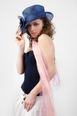 Naklejka premium Portrait of attractive elegant woman in blue hat.