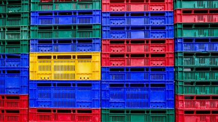 many colors stack of plastic crates background