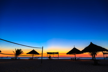 Fototapeta na wymiar Sunset over the ocean at a resort