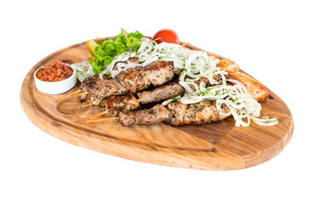 Healthy barbecued lean cubed pork kebabs served with