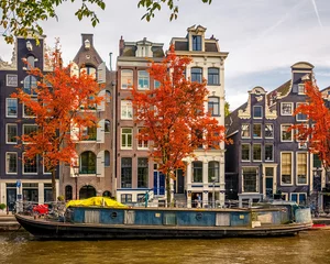 Fotobehang Buildings on canal in Amsterdam © sborisov