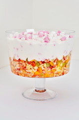 Marshmallows in cream over fruit salad