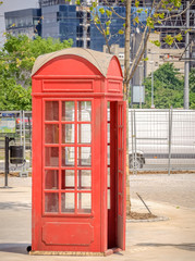 Red British Telephone Booth old and rustic