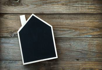 House Shaped Chalkboard sign  on rustic wood with place for text