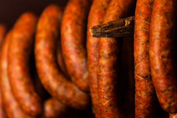 Traditional food. Smoked sausuages in smokehouse.