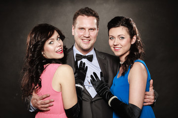 Love triangle. Two smiling women and man. Fun.