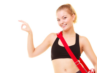 Sport. Fitness girl with gym bag showing ok hand sign