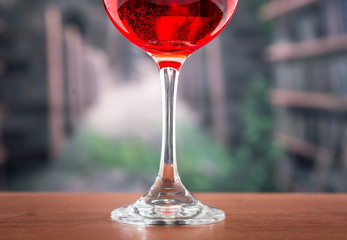 glass with red liquid cocktail