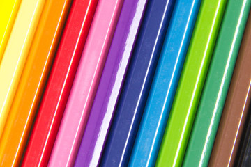 Collection of colored pencils forming a background