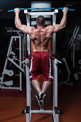 Bodybuilder Doing Exercise For Back