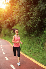 fitness woman runner running on trail