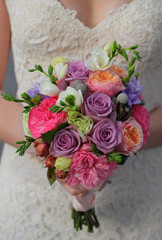 wedding bouquet in hands of the bride