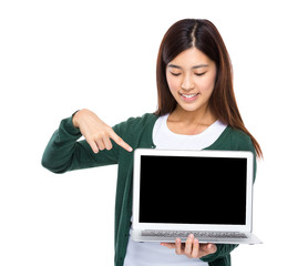 Woman finger point to blank screen of laptop computer