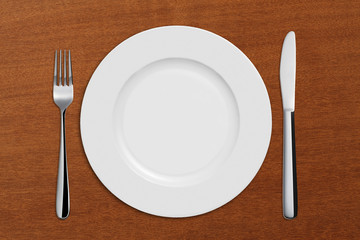 Dinner Plate, Knife,Spoon,on wooden table