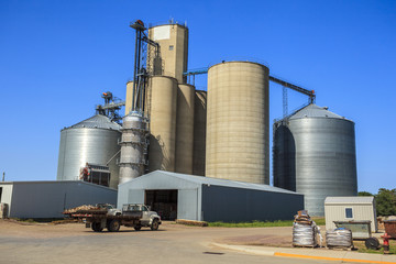Silver, shiny agricultural silos