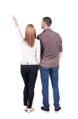 young couple pointing.