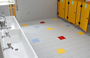 sinks and washbasins with low taps in the toilets of a nursery