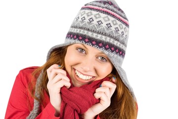 Cold redhead wearing coat and hat