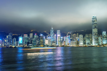 Fototapeta na wymiar Hong Kong. Skyscrapers reflection with boat light trails