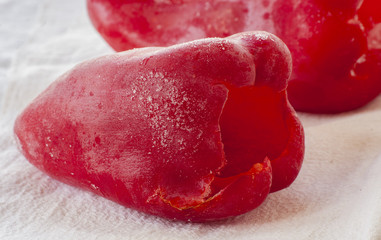 Frozen red colored pepper close up