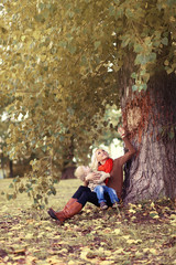 Lifestyle happy family in autumn, mother and child