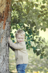 Portrait cute kid in autumn park