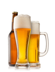 Beer glasses with bottle on white background
