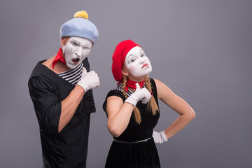 Couple of two funny mimes isolated on background