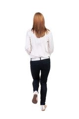 back view of running  woman in jeans