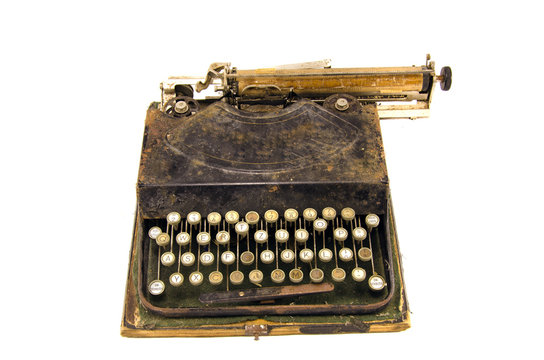ancient used typewriter isolated on white