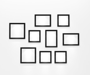 composition of blank black picture frames on white